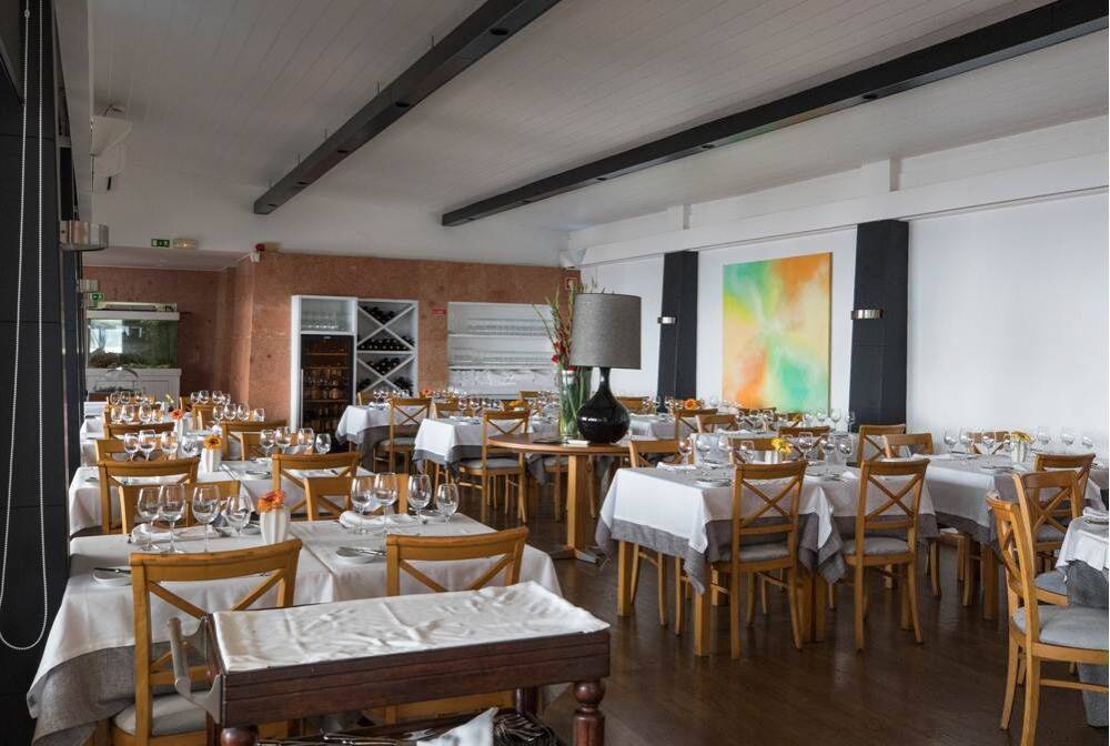 Elegant dining room at Monte Mar restaurant with refined atmosphere and prepared tables